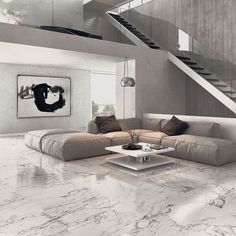 a modern living room with marble floors and white walls, stairs leading up to the second floor