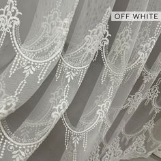 white lace curtains with the words off white on it