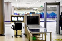 an airport baggage claim area with luggage carts