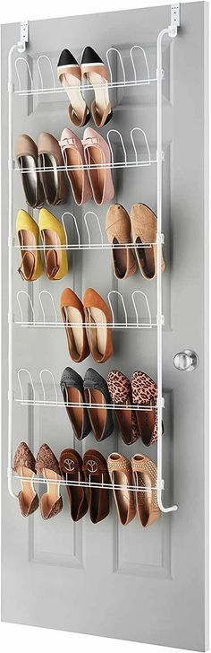 the shoe rack is holding many pairs of shoes