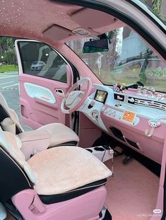 the interior of a pink car with black trim