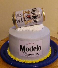 a cake made to look like a modelo beer can on top of the cake