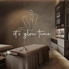 a spa room with the words it's glow time written in white on the wall