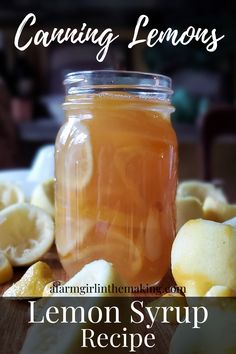 a jar filled with lemon syrup sitting on top of a table