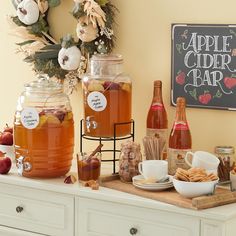 there are many different types of apple cider bar on the counter with apples and cinnamons