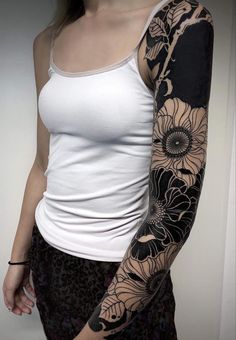 a woman with a tattoo on her arm