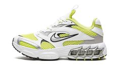 The Women’s Nike Zoom Air Fire “Lemon Twist” is a women’s version of the retro-inspired lifestyle shoe with an early 2000s vibe.  Inspired by running shoes from that era, the Women’s Nike Zoom Air Fire is designed in a hard-to-miss way with white leather overlays placed on top of a Lemon Twist mesh base.  A silver Swoosh with black trim appears on either side of the shoe.  A neon green Swoosh is embroidered on the heel.  Underfoot, Nike supplies the model with its signature visible Zoom Air cush Nike Vapormax Women, Nike Zoom Air Fire, Fire Shoes, Nike Zoom Air, Nike Vapor Max, Neon Heels, Black Huarache, Lemon Twist, Air Fire