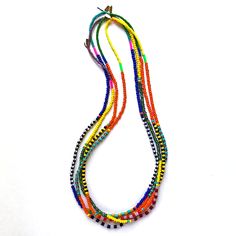 These colorful beaded necklaces are designed to look great as a single strand or mixed together in groups of two, three, four or more! We make these using vintage and new glass beads (with a few lucite pieces added in for a pop of fluorescent color) strung on a waxed poly/cotton cord. About 26" long. Handmade in the USA. Sold individually. Multicolor Multi-strand Necklaces With Tiny Beads, Colorful Multi-strand Beaded Necklaces For Festival, Colorful Multi-strand Beaded Festival Necklaces, Multi-strand Glass Bead Colorful Necklace, Multicolor Beaded Plastic Necklace, Fluorescent Colors, Strand Necklace, Bead Strand, That Look