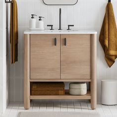 a bathroom with a sink, mirror and towel rack