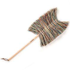 a multicolored duster with wooden handle on a white background