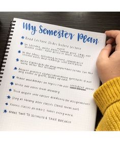 a person holding a pen and writing on a paper with the words'my somerset plan '