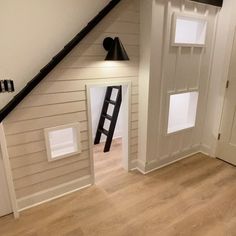 an open door leading to a loft with stairs