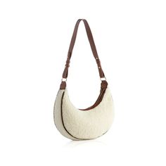 We love this ivory sherpa type shoulder bag .It's perfect for the cooler wintery months! L 12" x W 2" x H 12"; hnd 6", smooth pu, gold hardware, single shoulder strap, top zip closure, 1 inner zip pocket, 1 inner slip pocket, China, Vegan Cream Shoulder Bag For Winter Travel, Winter Travel Cream Shoulder Bag, Cream Winter Shoulder Bag, White Shoulder Bag For Everyday Winter Use, Winter Cream Shoulder Bag For Daily Use, White Winter Shoulder Bag For Everyday Use, Cream Tote Shoulder Bag For Winter, Winter Cream Tote Shoulder Bag, Winter Beige Crossbody Shoulder Bag