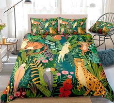 bedding with jungle animals and plants on it