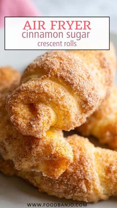 cinnamon sugar crescent rolls on a plate with the words air fryer cinnamon sugar crescent rolls