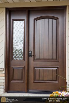 the front door is brown and has two sidelights