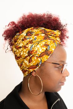 Be unapologetic in our printed head wrap. It’s made from 100% African wax print cotton which makes it lightweight, making it is easy to wrap and great to wear all year round. Our printed head wraps are great for all hair types from afros, short hair, locs, braids, and every other style you can think of. Unlike our jersey head wraps, our printed head wraps has no stretch but will soften after washing. Dimensions: 35cm x 175cm All cotton. Handmade with love.