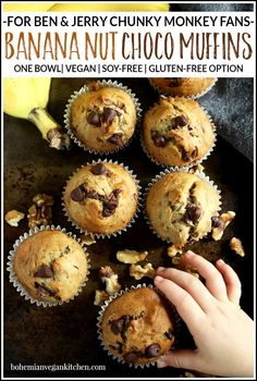 banana nut choco muffins on a baking sheet with a hand reaching for one