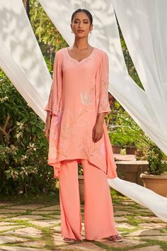 Peach tunic with sequin and cutdana embroidery. Paired with a flared pant. - Aza Fashions Peach Crepes, Cutdana Embroidery, Woven Wrap, Tunic Pattern, Embroidered Tunic, Pant Set, Set For Women, Flare Pants, Aza Fashion