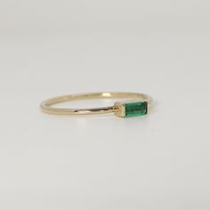 This beautiful baguette emerald Gold Ring was handmade in Melt'm Jewelry Design Studio in California using 14k solid yellow gold band and 4 x 2mm baguette lab grown emerald stone. DETAILS ABOUT THE RING, MATERIAL AND STONES Ring Band: 14K solid gold Ring Band size: 1 mm thick Gemstone: Lab Grown Emerald Emerald size: 4 mmx 2 mm baguette cut It is a great birthday gift for your special ones whose birthday are in May, since Emerald is May birthstone. This solid gold ring makes a perfect present fo Baguette Cut Emerald Ring For May Birthstone, Everyday Emerald Ring In Yellow Gold, 14k Gold Stackable Emerald-cut Rings For May Birthstone, 14k Gold Emerald-cut Stackable Rings For May Birthstone, Everyday Minimalist Emerald Cut Ring, Everyday Minimalist Emerald Ring, Modern Baguette Cut Emerald Ring For May Birthstone, 14k Gold Emerald Ring With Baguette Cut, 14k Gold Baguette Cut Emerald Ring For May Birthstone