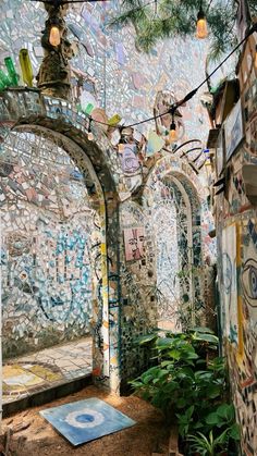 the inside of an old building with stained glass windows and mosaic tiles on the walls