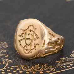 We absolutely adore wax seal signet rings - who can be mad at the junction of function and beauty? This antique number is smooth like butter with the most charming detail throughout. At face value, the stamp looks like a backwards “S” and a lowercase “g” but when you use it with actual wax, it imprints an “S” and “P.” So much charm and character with this signet, with that delicious bold gold look on the finger. 14kt yellow gold Size 6.25 and resizable Please see qualitative report for more info Collectible Yellow Gold Signet Ring With Initials, Vintage Stamped Initial Ring For Anniversary, Vintage Initial Ring For Anniversary, Antique Stamped Yellow Gold Engraved Ring, Antique Signet Ring With Hallmarks As A Gift, Elegant Stamped 14k Gold Signet Ring, Heirloom 14k Gold Signet Ring With Maker's Mark, Vintage Signet Ring With Engraving Option, Antique Signet Ring With Maker's Mark For Formal Occasion