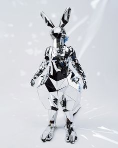 an animal made out of mirrored objects on a white background