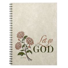 a spiral notebook with the words let go and god on it, surrounded by flowers