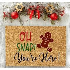 a door mat that says oh snap you're here with a ginger on it