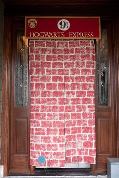 the hogwart's express sign is displayed in front of a brick building door