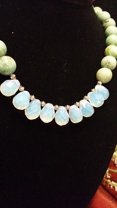 "This is a gorgeous, one of a kind, statement necklace designed and hand crafted personally by Petronella Greer. It's a 1 strand design, made of a light turquoise and opalite that turns colors. The length of the necklace is 18\". The clasp is high quality. It's an exquisite and unique piece of jewelry that no one else will have but you! Also, comes in very nice packaging!" Handmade Turquoise Chrysoprase Necklaces, Bohemian Faceted Turquoise Beaded Necklaces, Adjustable Faceted Turquoise Necklace, Adjustable Faceted Turquoise Beaded Necklaces, Turquoise Faceted Bohemian Jewelry, Faceted Turquoise Crystal Necklaces For Jewelry Making, Unique Turquoise Necklaces With Faceted Beads, Turquoise Faceted Amazonite Jewelry, Faceted Turquoise Amazonite Jewelry