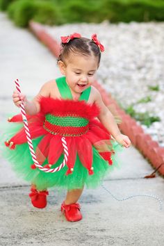 Please leave your event date in the notes to seller. Our current turn around time is 2 weeks for holiday orders The ELF tutu dress is an absolute must have for every little princess. It is perfect for the holiday, holiday photos or just to wear on Christmas! The dress is made out of a crochet top covered with a red marabou trim at the top and green halter straps that criss cross in the back and tie in a bow. The skirt is layered with green on the bottom and red in the top. The red tulle is gathe Feather Tutu, Toy Story Halloween, Elf Dress, Toy Story Costumes, Sweet Pictures, Photography Christmas, Harry Potter Halloween, Elf Clothes, Tulle Tutu