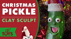 a christmas pickle clay sculpture with the words clay sculpt in front of it