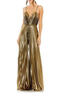 Enter your next special event in a disco-chic manner with this crisp, accordion-pleated jumpsuit styled with flowy wide legs, slender straps and a banded waist. 61" length; 31 1/2" inseam; 136" leg opening (size 8) Plunge neck Spaghetti straps Partially lined 100% polyester Spot clean Imported Asian Owned/Founded Pleated Jumpsuit, Formal Jumpsuit, Mac Duggal, Metallic Fabric, Jumpsuit Fashion, Sleeveless Jumpsuits, Gold Dress, Fashion Fabric, Wide Leg Jumpsuit