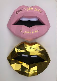 three different types of paper lips with names on the front and back, one is pink, one is gold