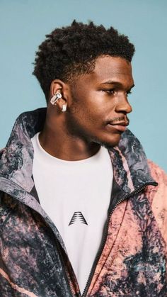 a young man with an earring in his ears