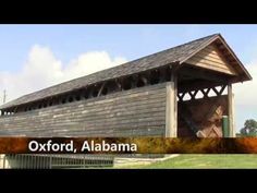 an old wooden covered structure with the words oxford, alabama on it's side