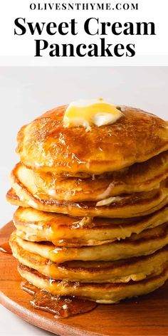 a stack of pancakes with butter on top and the words sweet cream pancakes above it