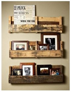 three wooden shelves with pictures on them in a living room or dining room, one is made out of pallet wood and the other has multiple frames