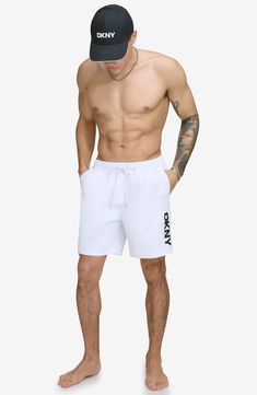 Hit the boardwalk or go for a swim in these volley swim trunks built from quick-drying fabric with UPF 40+ sun protection. 7" inseam (size Medium) Elastic/drawstring waist 100% REPREVE® recycled polyester REPREVE recycled polyester is made from 100% post-consumer recycled plastic bottles Machine wash, line dry Imported White Sporty Swim Trunks For Water Sports, White Moisture-wicking Swim Trunks, White Moisture-wicking Swim Trunks For Swimming, White Moisture-wicking Swimwear For Water Sports, White Short Swim Trunks For Water Sports, Sporty White Shorts For Water Sports, Sporty White Swim Trunks For Pool, White Athleisure Swim Trunks For Swimming, White Athleisure Swim Trunks For Summer