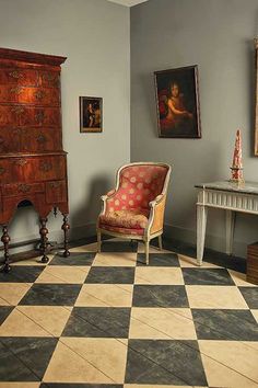 a room with a checkered floor and furniture