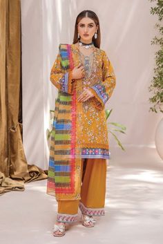 EMB Printed Cambric Front Printed Cambric Back Printed Cambric Sleeves Crystal Slub Dupatta Cambric Trouser Color: Mustard Formal Suits, Indian Fashion