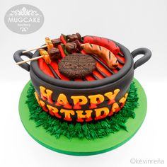 a birthday cake that is shaped like a grill and some food on top of it