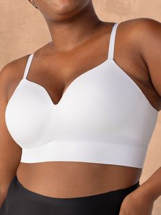 Your new everyday bra for the best fit, ultimate comfort, and flattering style is here! The Truekind® Supportive Comfort Wireless Shaping Bra delivers wire-free support with the natural lift you want. Get a smooth shape and seamless appearance under any top, with its modern, ultra-soft fabric that feels like second skin. Use the adjustable straps to customize your comfort. Plus, the molded cups were designed to naturally shape any breast shape and size. Perfect fit. Ultimate comfort. Flattering White Seamless Full Coverage Shapewear, White Shapewear With Bra-friendly Shaping, White Shapewear With Bra Friendly Shaping, Supportive Full Coverage Smoothing Bra, Solid Sculpting Seamless Bra, Shaping Seamless White Bra, Smoothing Full Coverage Bra, Supportive Solid Color Smoothing Bra, Foam Cups