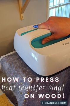 a person using a heat transferer on a bed with the words how to press heat transfer