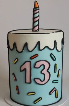 a blue birthday cake with a candle on it's top that reads 13 1 / 2