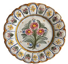 a decorative plate with flowers painted on it