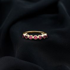 Product Details Make her day unforgettable with this beautiful Semi Eternity Ring. Adorned with sparkling Round Cut Lab Created Ruby in a secure Bezel Setting, this ring is a perfect symbol of your never-ending love. Crafted in a unique design, this Created Ruby Half Eternity Ring will make her feel special every day. Product Information SKU SHP-RINGS0821258490 Width 2 mm Height 3.3 mm Weight 1.44 gm (Approximate) LAB CREATED RUBY INFORMATION No.of Stones 9 Pieces Total Weight 1.30 Carat (Approx Make Her Feel Special, Half Eternity Ring, Signature Jewelry, 18k Yellow Gold Ring, Timeless Jewelry, Ruby Gemstone, Feel Special, Ruby Ring, Conflict Free Diamonds