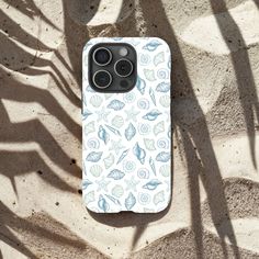 an iphone case with shells and seashells on it