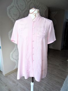 "Vintage 80's Pastel Baby Pink Button Down Short Sleeve Summer Blouse Shirt Women  * Size EU 44 UK 16  US 12  Please check measurements Approx fit S -  L ( Maneken size is M) * 100% Polyester * Light Pink * Shoulder pads * Fastens with 7 buttons * Great vintage condition. Ready to wear.  Measurements: Shoulders - 16.5\" / 42cm Pit to pit - 22\" / 56cm Back Length - 27\" / 69cm Sleeve - 9\"  / 23cm ☆ SHIP WORLDWIDE ☆ I ship from Latvia EU worldwide. Estimated delivery time to: European Union 5 - 7 Business days; USA 2 - 3 weeks; Worldwide 3 - 5 weeks. Thank you for checking in and let me know if you have any questions!  Cheers,  Shop Vintage Commode" Pink Embroidered Button-up Blouse, Pink Button-up Tops With Floral Embroidery, Embroidered Short Sleeve Daywear Shirt, Pink Embroidered Collared Top, Embroidered Short Sleeve Day Shirt, Embroidered Short Sleeve Tops For Daywear, Embroidered Short Sleeve Shirt For Daywear, Pink Embroidered Tops For Daywear, Embroidered Button-up Daywear Top